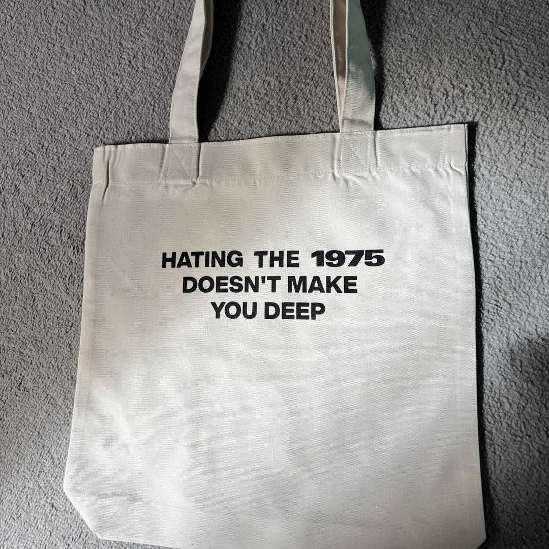 Hating the 1975 doesn’t make you deep tote bag
