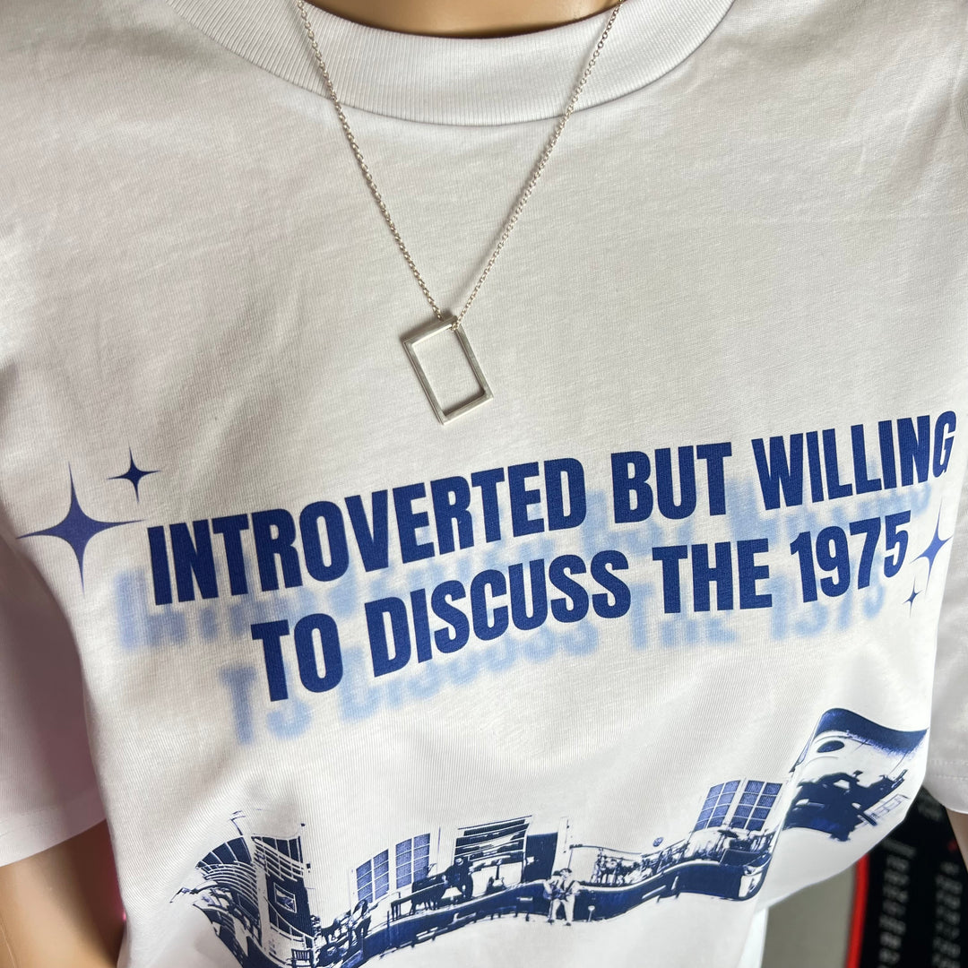 Introverted but willing to discuss the 1975-  print graphic tee